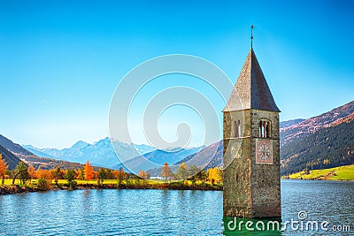 Fantasic autumn view of submerged bell tower in lake Resia Stock Photo