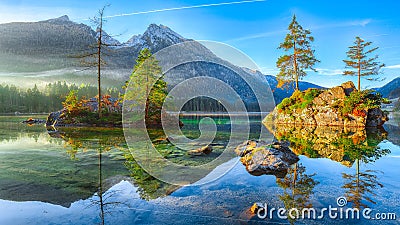 Fantastic autumn sunrise of Hintersee lake. Classic postcard vie Stock Photo