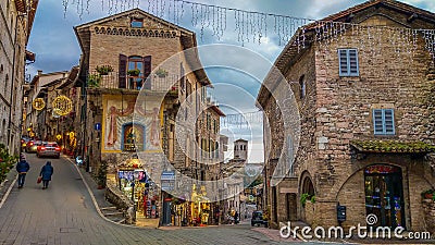 Fantastic medieval street of Assisi with christmas decorations at winter time, HDR Editorial Stock Photo