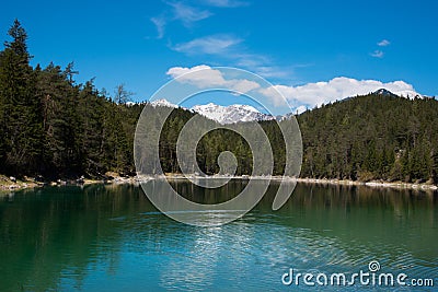 Fantastic sundown on mountain lake Eibsee, located in the Bavaria, Germany. Dramatic unusual scene. Alps, Europe. Stock Photo