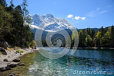 Fantastic sundown on mountain lake Eibsee, located in the Bavaria, Germany. Dramatic unusual scene. Alps, Europe. Stock Photo