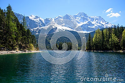 Fantastic sundown on mountain lake Eibsee, located in the Bavaria, Germany. Dramatic unusual scene. Alps, Europe. Stock Photo