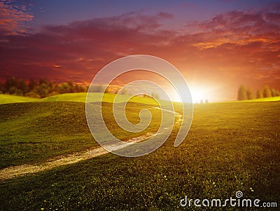 Fantastic sunset over summer green hills Stock Photo