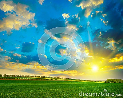 Fantastically beautiful bright sky over farm field Stock Photo