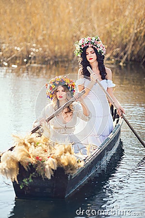 Fantasy art photo of a beautiful girls in boat Stock Photo