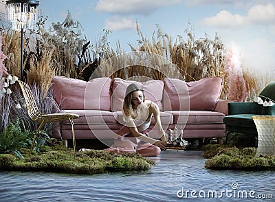 Fantasy concept with a girl releasing a boat on the water Stock Photo