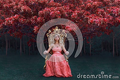 Fantasy concept of queen sitting on the throne in magical forest Stock Photo