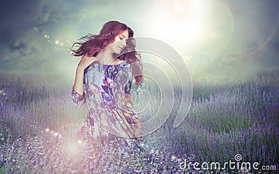 Fantasy. Woman in Enigmatic Meadow over Cloudy Sky Stock Photo