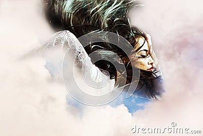 Fantasy woman flying through the clouds Stock Photo