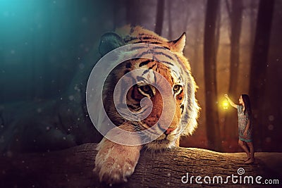 A fantasy world - a woman and a giant tiger Stock Photo