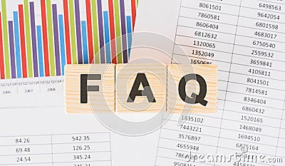 Faq word written on wood block. Faqs text on table, concept Stock Photo