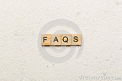 faqs word written on wood block. faqs text on table, concept Stock Photo