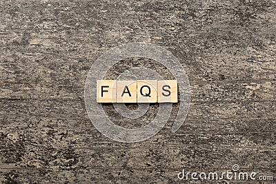 faqs word written on wood block. faqs text on table, concept Stock Photo