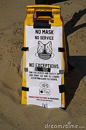 `No Mask No Service No Exceptions` sign at a concession stand in Jacob Riis Park in Far Rockaway Editorial Stock Photo