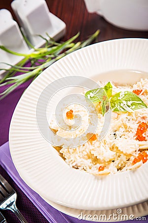 Farfalle with basil and caviar Stock Photo