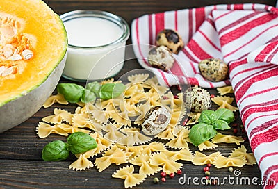 Farfalle pasta, pumpkin, cream and Basil Stock Photo