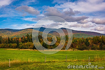 Farm field and autumn color in the White Mountains near Jefferson, New Hampshire. Stock Photo