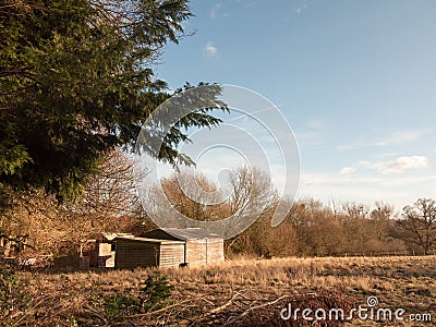 farm field outside with shed nature agriculture empty Stock Photo