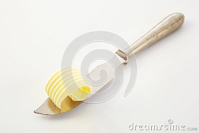 Farm fresh butter cut in an elegant curl Stock Photo