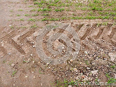Farm land tire tractor track background dirt path floor grass Stock Photo