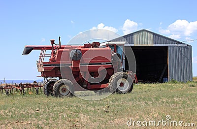 Farm machinery and shed. Stock Photo