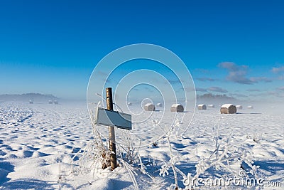 Farm name road sign near winter field Stock Photo