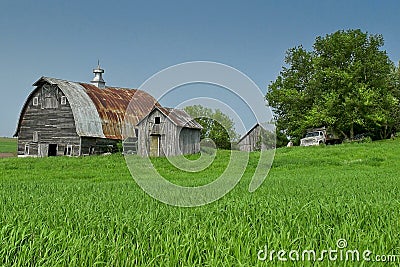 Farm scene with barn and outbuildings Stock Photo