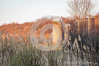 Farm Silos at Sunset Stock Photo