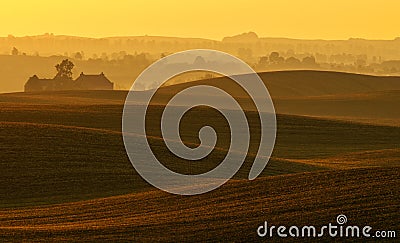 The farm on undulating fields of autumn Stock Photo