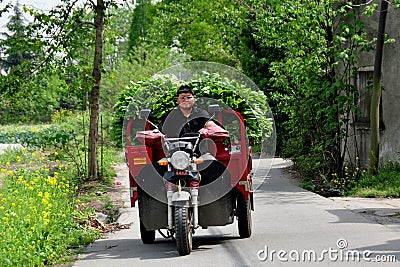 Pengzhou, China: Farmer Driving Cart Editorial Stock Photo