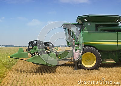 Farmer Exits Harvester Stock Photo