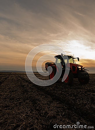 Farmer fertilizing arable land with nitrogen fertilizer Stock Photo