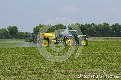 Farmer fertilizing field Editorial Stock Photo