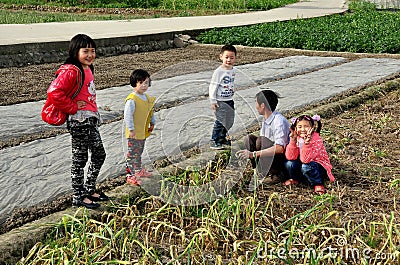 Pengzhou, China: Farmer with Children Editorial Stock Photo
