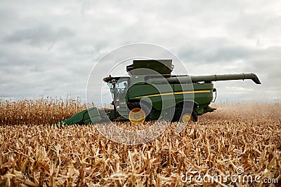 Farmer harvesting maize in autumn Stock Photo