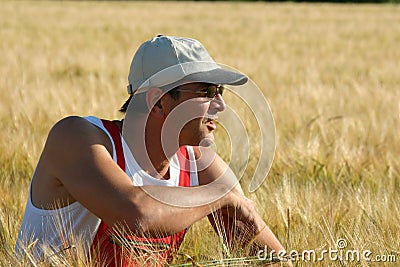 Farmer inspecting the barley Stock Photo