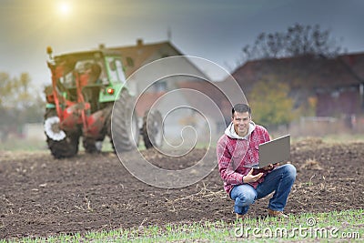 Farmer with laptop Stock Photo