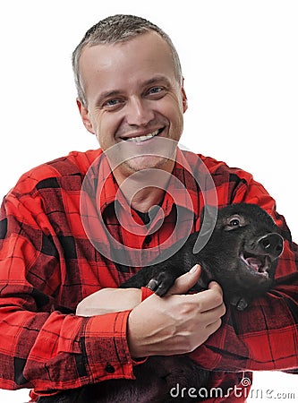 farmer with a little piglet Stock Photo