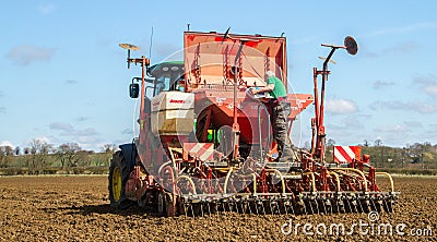 Farmer loading up seed drill ready for drilling Editorial Stock Photo
