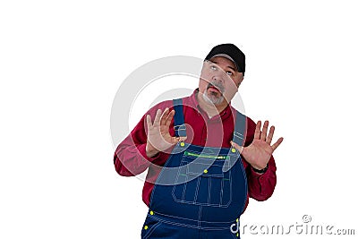 Farmer or manual worker looking up in trepidation Stock Photo