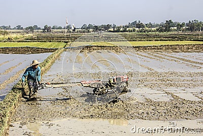 Farmer with motor plow Editorial Stock Photo