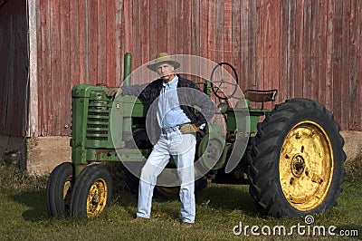 Farmer Poses With His Tractor Editorial Stock Photo