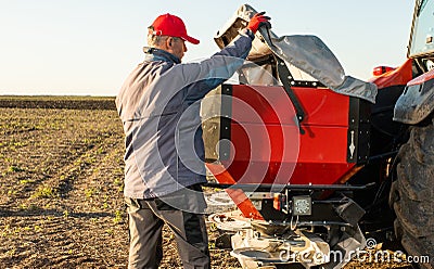 Farmer preparing artificial fertilizers for work Stock Photo