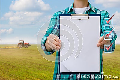 Farmer shows check list . Stock Photo