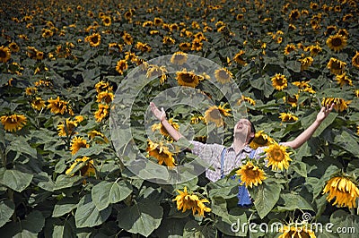 Farmer in sunflower field Stock Photo