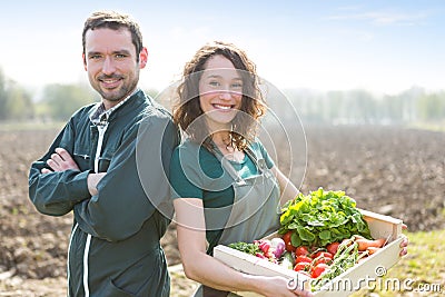 Farmer team at work in a field Stock Photo