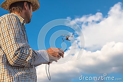 Farmer using drone remote control Stock Photo