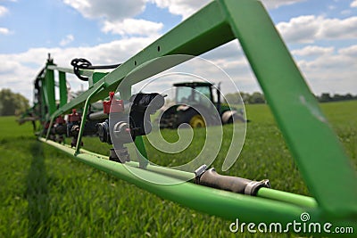 Farmer wheat field spraying herbicides. U Editorial Stock Photo