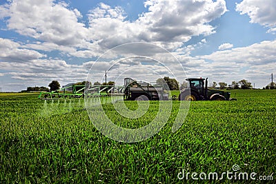 farmer wheat field spraying herbicides Editorial Stock Photo