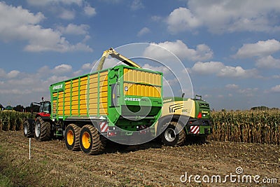 Farmers are harvesting corn with big machines Editorial Stock Photo